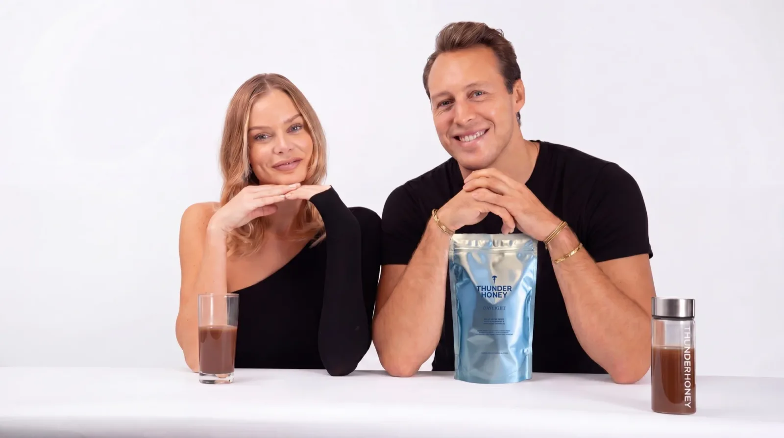 Thunder Honey founders at the table with the Daylight pouch and the drink
